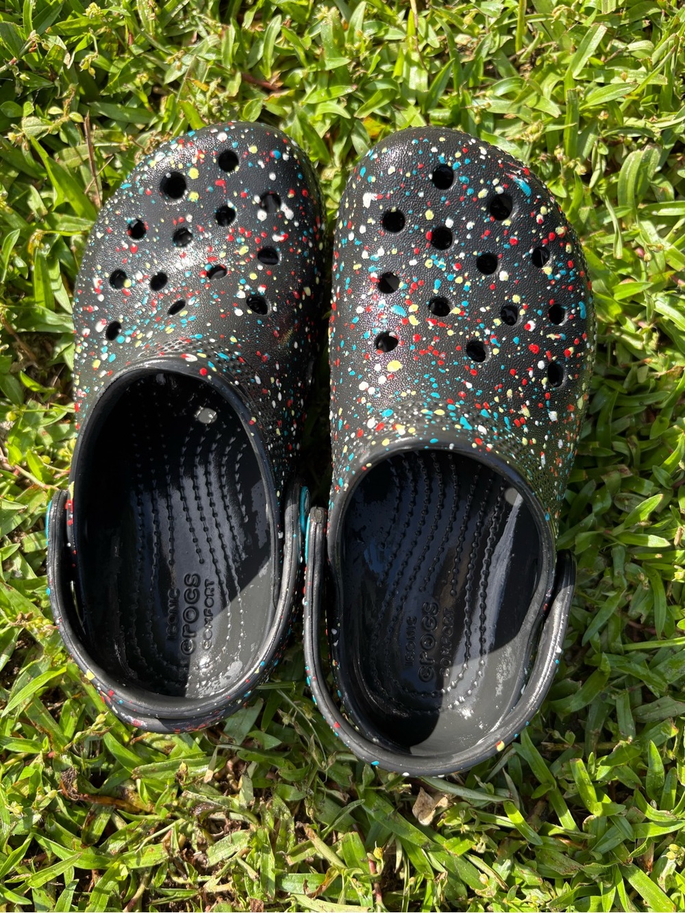 CROCS Kids Black Clogs with Multicolor Paint Splatter